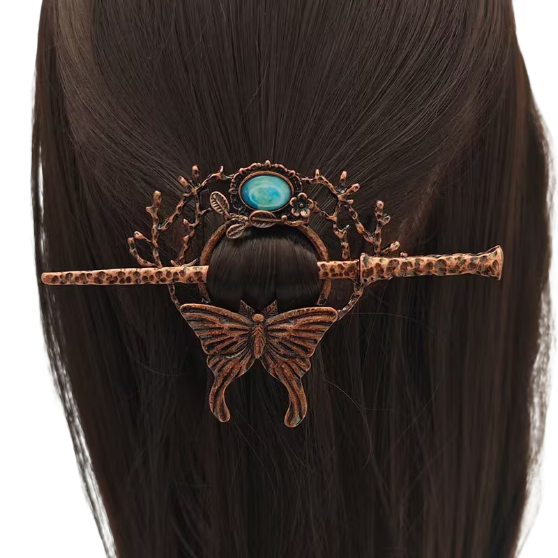 Mystische Haarnadel „Mondfalter“ in Kupferoptik mit blauem Stein